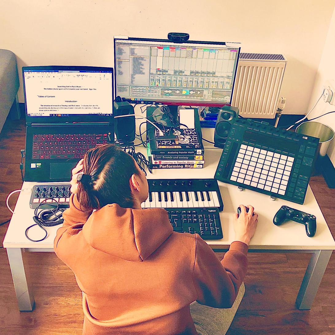 Research desk — thesis on screen beside Ableton and a Push controller